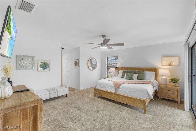 carpeted bedroom with ceiling fan