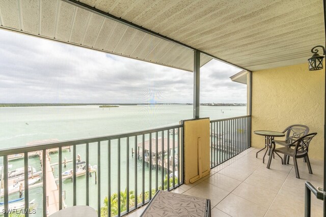 balcony featuring a water view