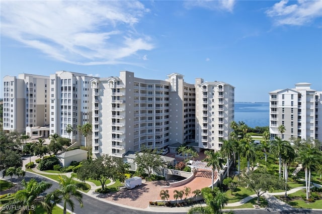 view of building exterior with a water view