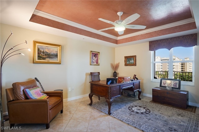 office area featuring ceiling fan, a raised ceiling, ornamental molding, and light tile patterned floors