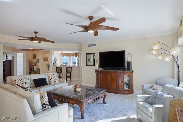 living room with crown molding and ceiling fan