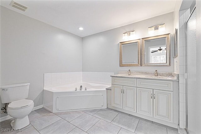 bathroom featuring toilet, a tub to relax in, ceiling fan, tile patterned floors, and vanity