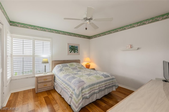 bedroom featuring ceiling fan and light hardwood / wood-style floors