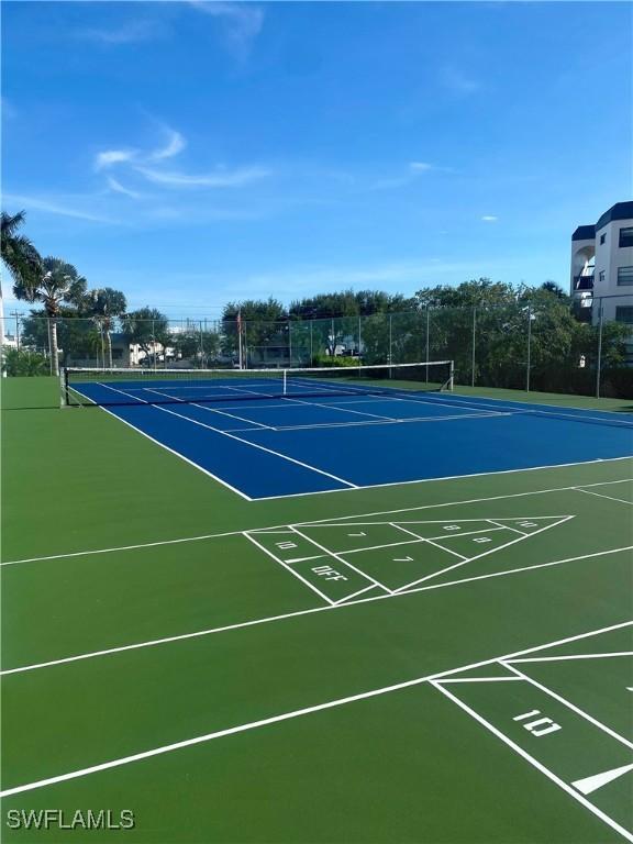 view of community with tennis court