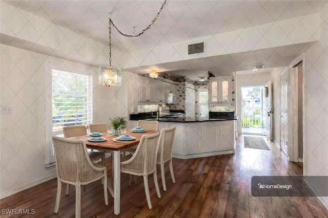 dining area featuring dark wood-type flooring