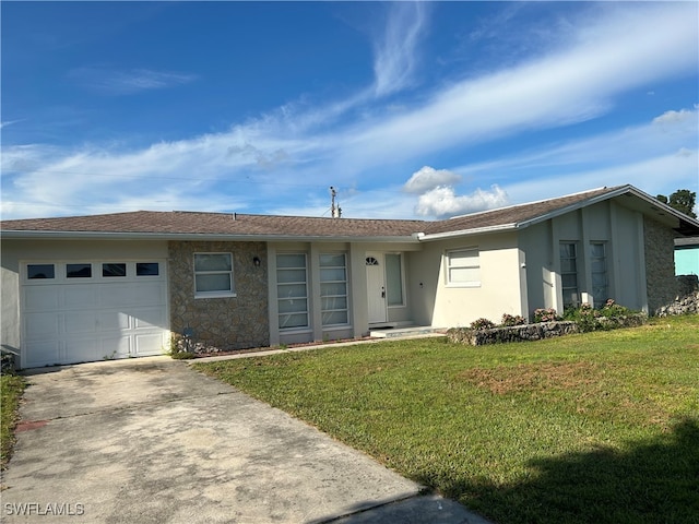 single story home with a front lawn and a garage