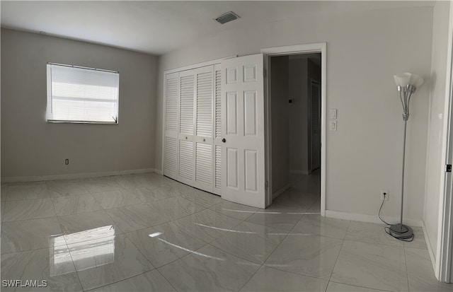 unfurnished bedroom featuring a closet