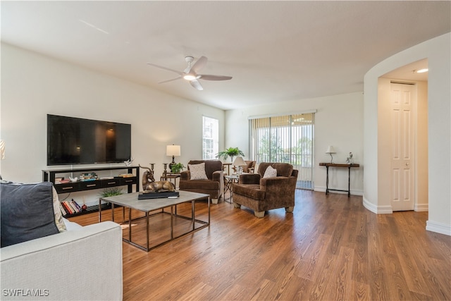 living room with hardwood / wood-style floors and ceiling fan