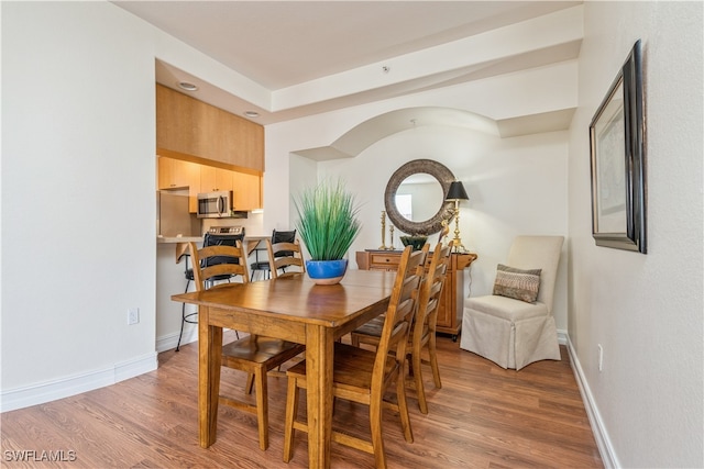 dining space featuring hardwood / wood-style flooring