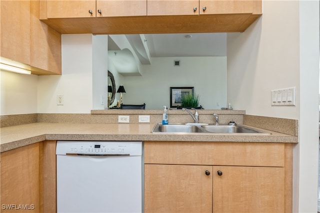 kitchen with sink, dishwasher, and light brown cabinets