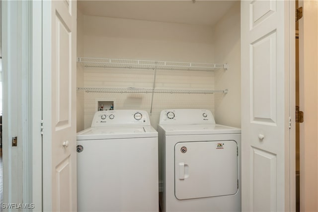 laundry room with washer and dryer