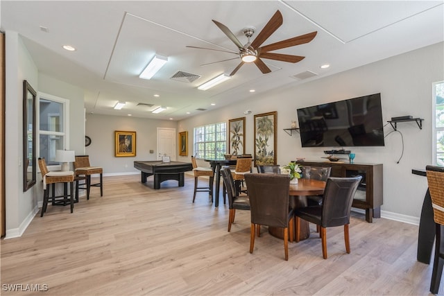 dining room with light wood-type flooring and ceiling fan