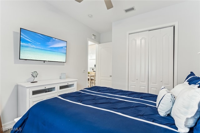 bedroom featuring ceiling fan and a closet