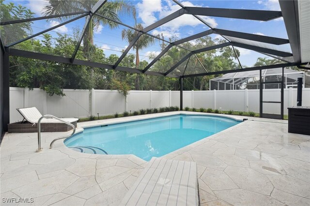 view of pool featuring a patio area and a lanai