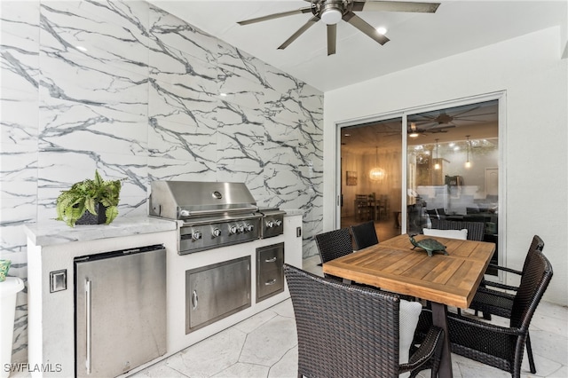 view of patio / terrace with ceiling fan, area for grilling, and grilling area