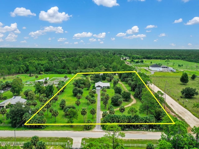 birds eye view of property with a rural view