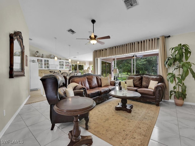 living room featuring vaulted ceiling and ceiling fan