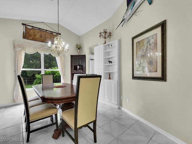 dining room featuring a notable chandelier, light tile patterned floors, and vaulted ceiling