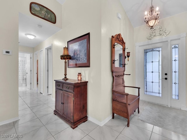 foyer featuring a chandelier