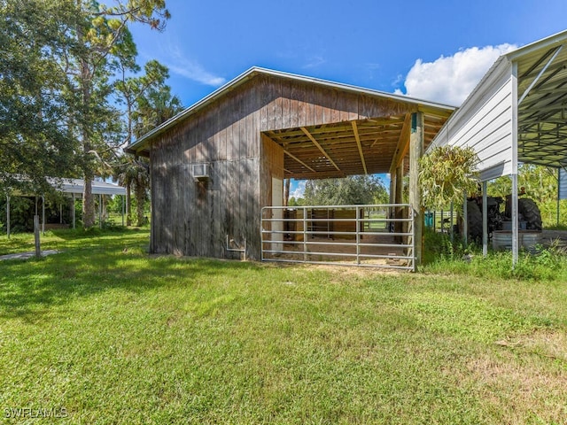 view of side of home with an outbuilding