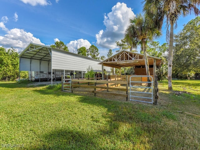 view of outdoor structure featuring a yard and a carport