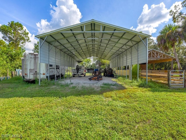 view of vehicle parking with a carport and a lawn