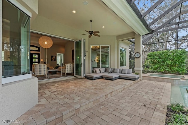 view of patio featuring a lanai, outdoor lounge area, ceiling fan, and a swimming pool with hot tub