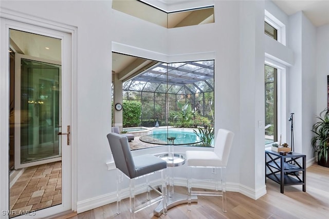 dining space with hardwood / wood-style floors