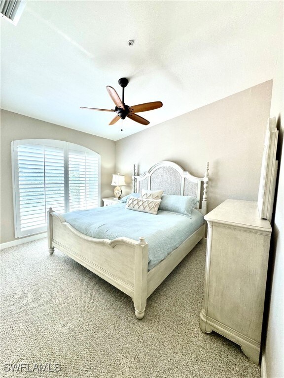 carpeted bedroom featuring ceiling fan