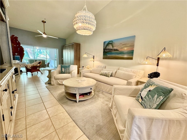 tiled living room featuring high vaulted ceiling and ceiling fan