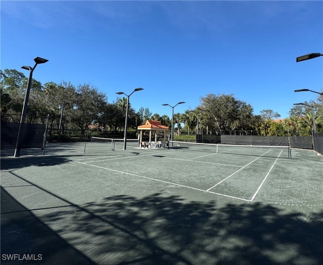 view of tennis court featuring a gazebo