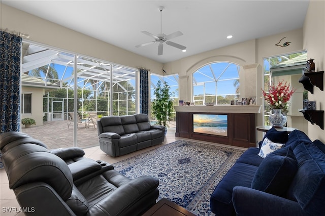 living room featuring ceiling fan and light tile patterned floors