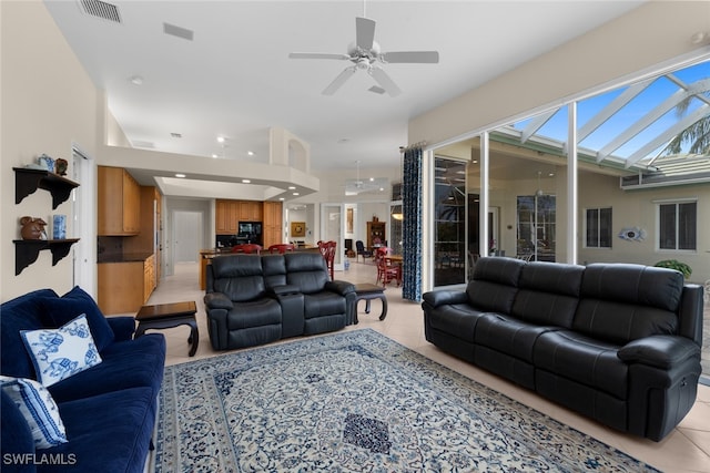 living room featuring ceiling fan and light tile patterned flooring