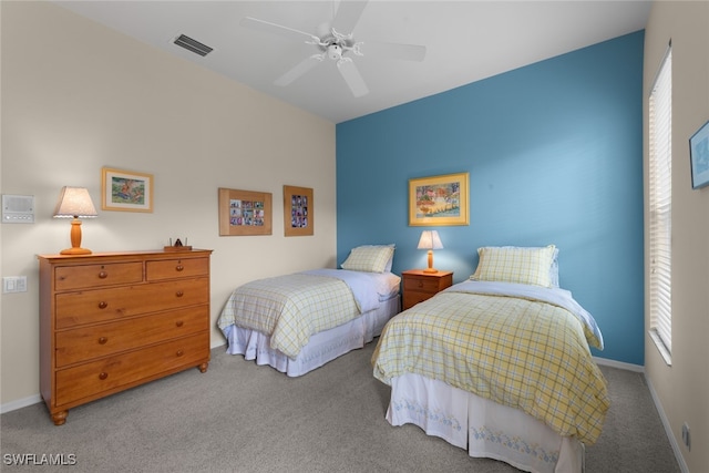 bedroom with ceiling fan and carpet floors