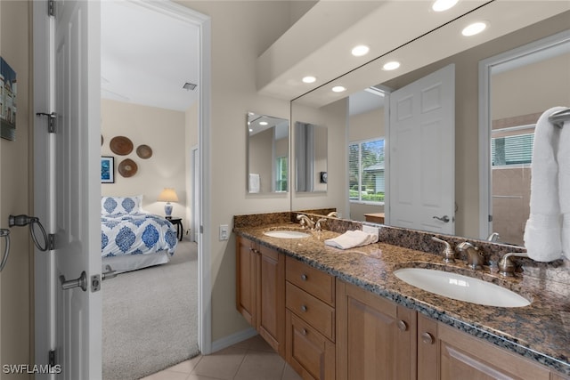 bathroom with tile patterned flooring and vanity