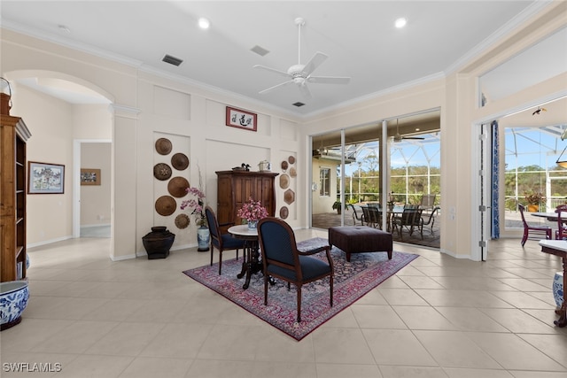 interior space featuring light tile patterned floors, ceiling fan, and crown molding