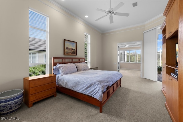 bedroom with ceiling fan, light colored carpet, crown molding, and multiple windows