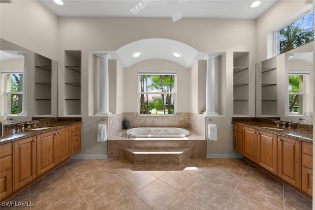 bathroom with ornate columns and plenty of natural light