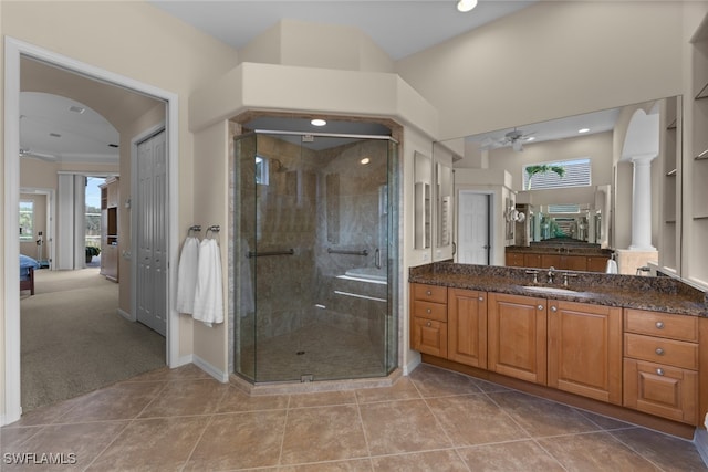 bathroom with an enclosed shower, vanity, tile patterned floors, and ceiling fan