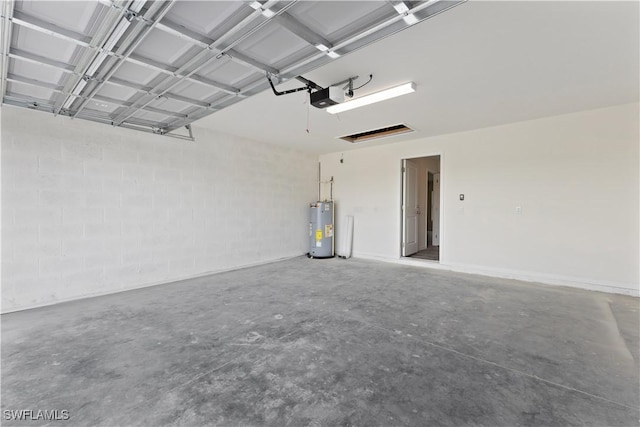 garage featuring a garage door opener and water heater