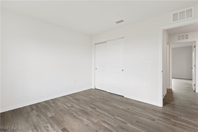 empty room featuring dark hardwood / wood-style floors