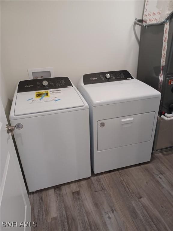 laundry room featuring dark wood-type flooring and washing machine and clothes dryer