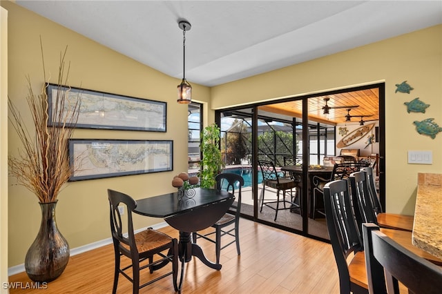 dining room featuring ceiling fan and light wood-type flooring