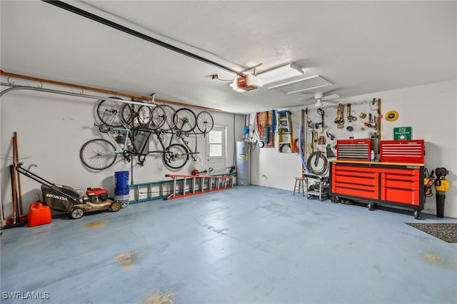 garage with a garage door opener, electric water heater, and a workshop area