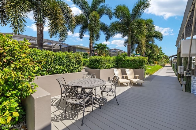 wooden terrace featuring a lanai