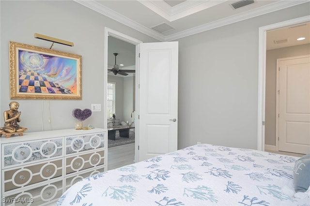 bedroom featuring ornamental molding and hardwood / wood-style floors