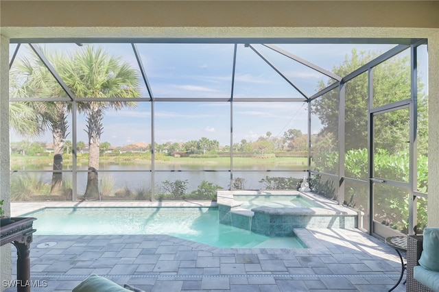 view of swimming pool with a patio area, an in ground hot tub, a water view, and glass enclosure