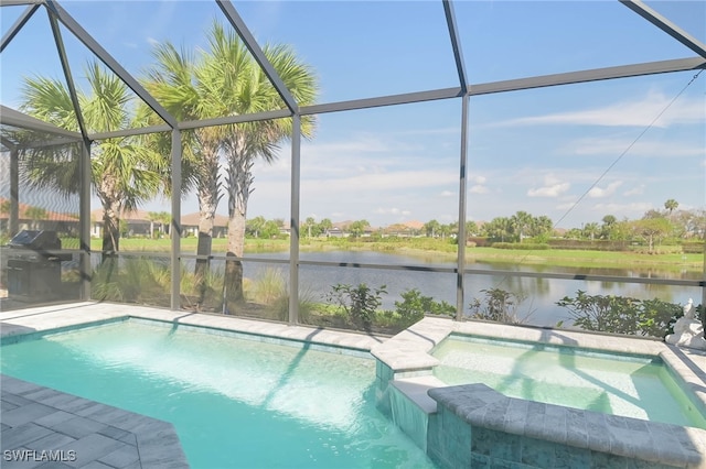 view of pool featuring an in ground hot tub, a water view, and glass enclosure