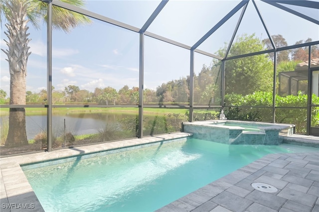 view of swimming pool featuring an in ground hot tub, a water view, and a lanai