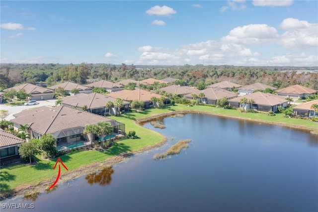 birds eye view of property with a water view